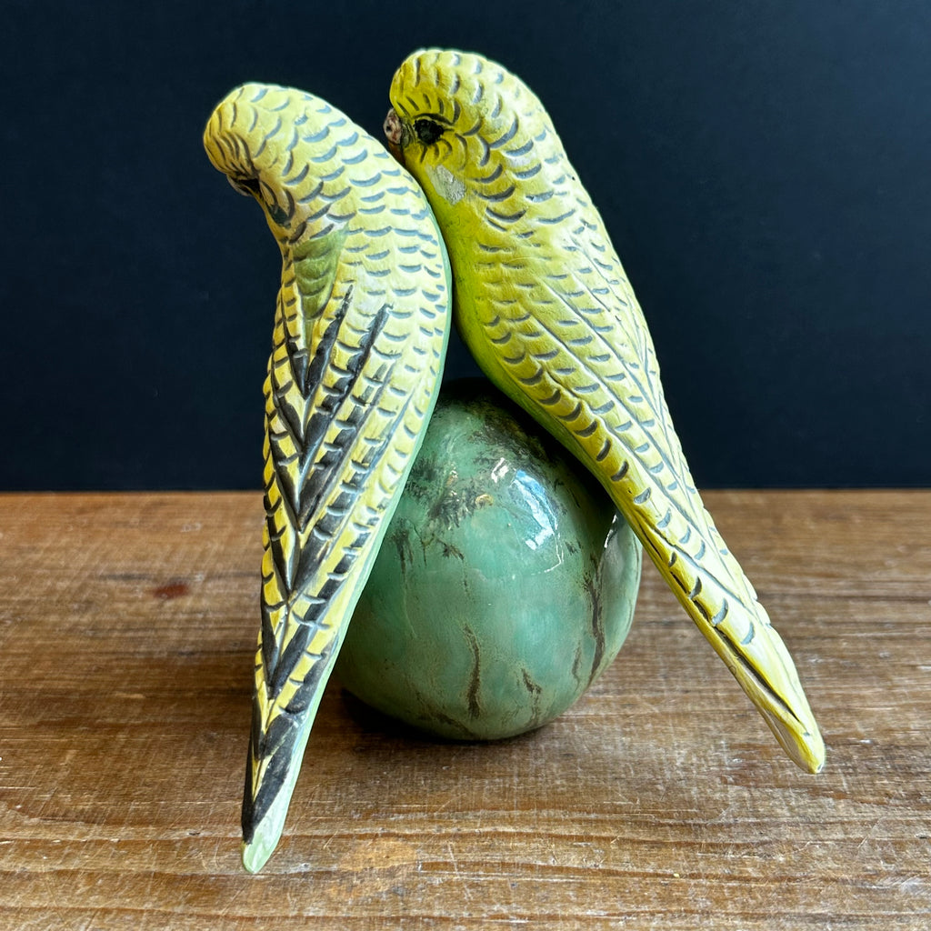 Two Medium Green Budgies on a Ball