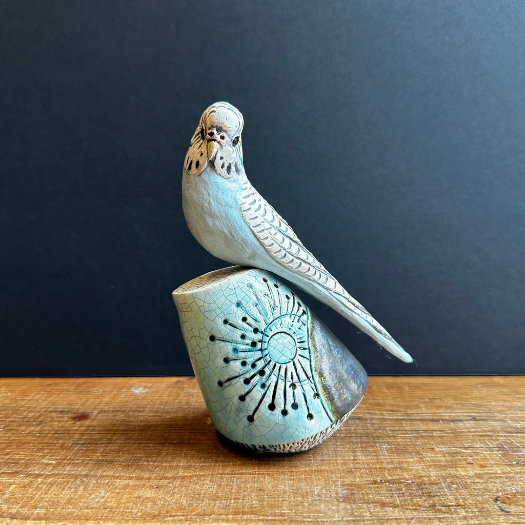 Large Blue Budgie on a Plinth