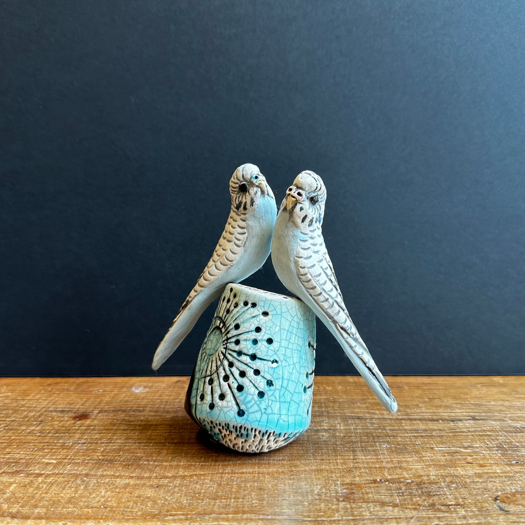 Pair of Small Blue Budgies on a Plinth