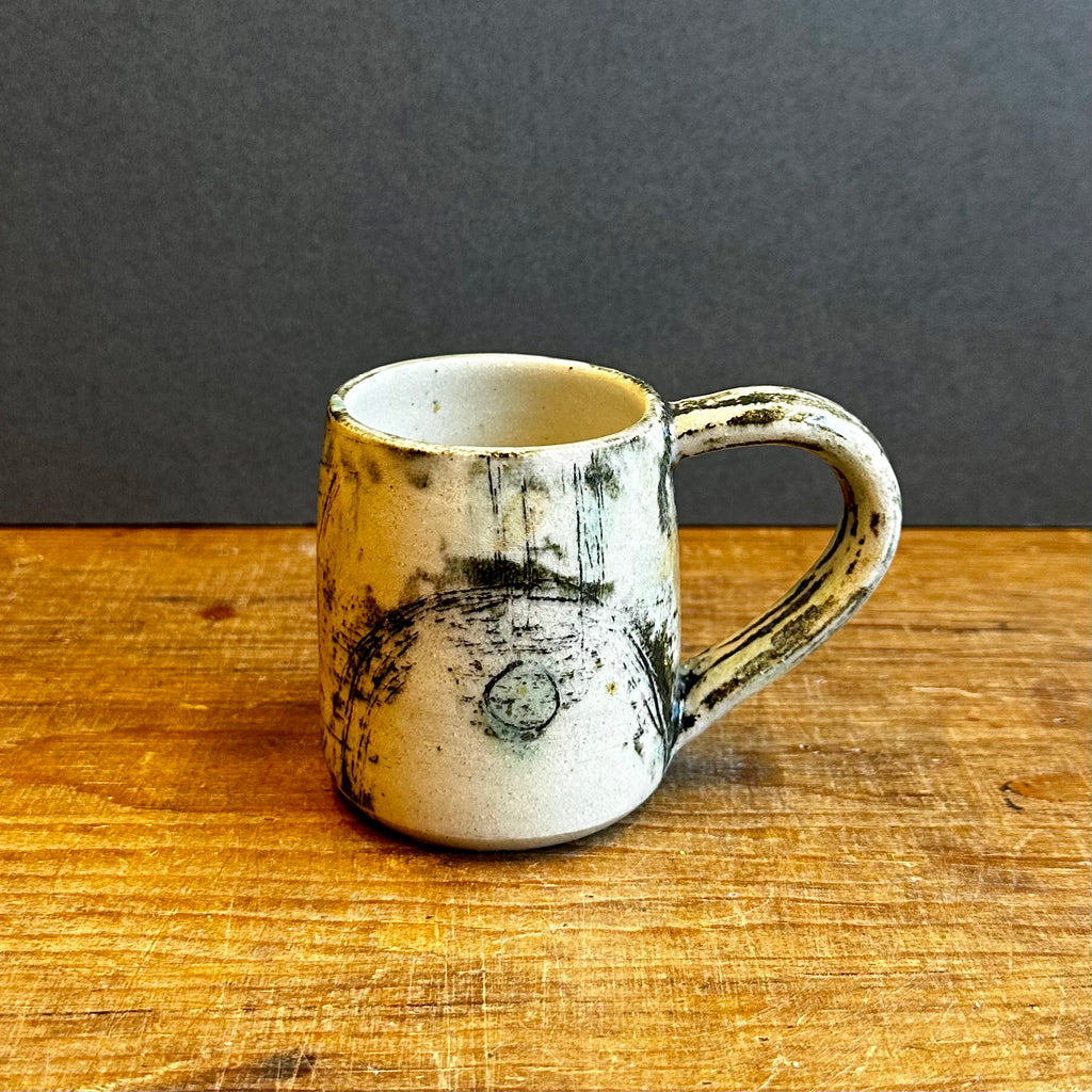 Grasping the Orient Espresso Mug